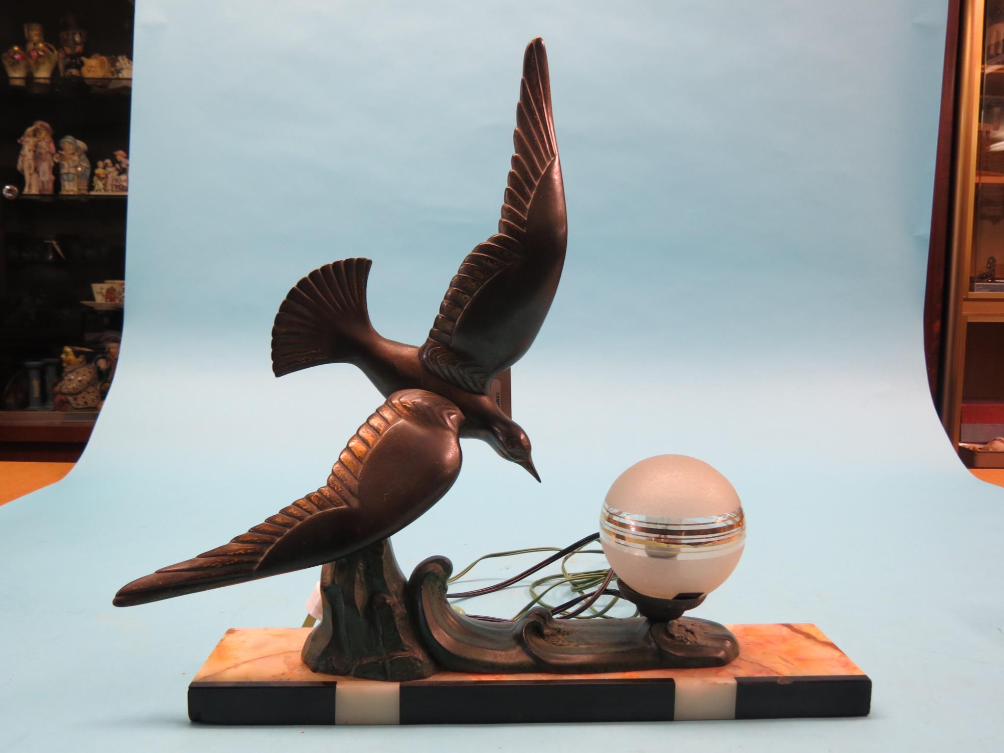 Appraisal: An Art Deco-style table lamp cast metal bird design with