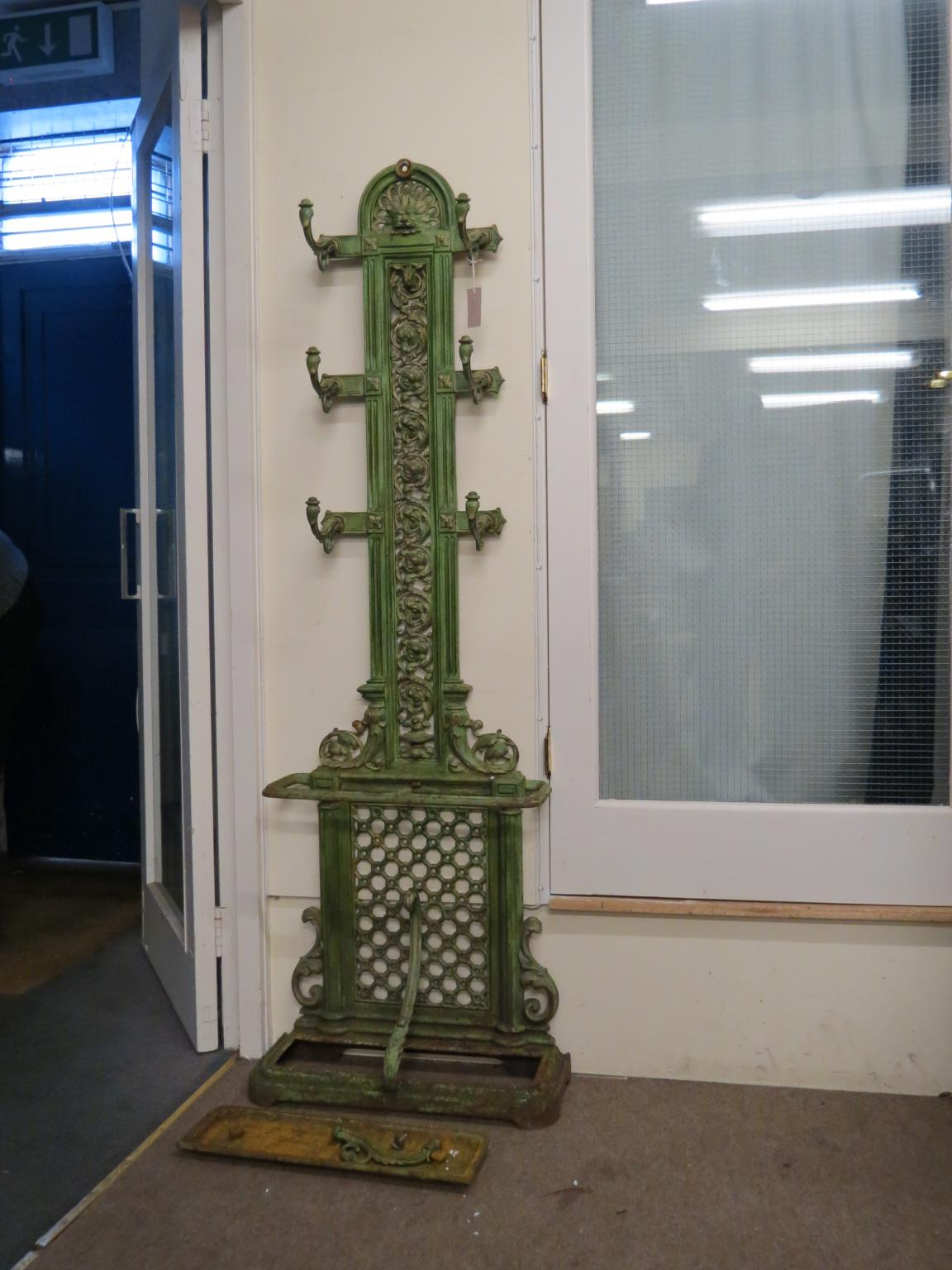 Appraisal: A Victorian cast iron hallstand green-painted with gilding fitted with