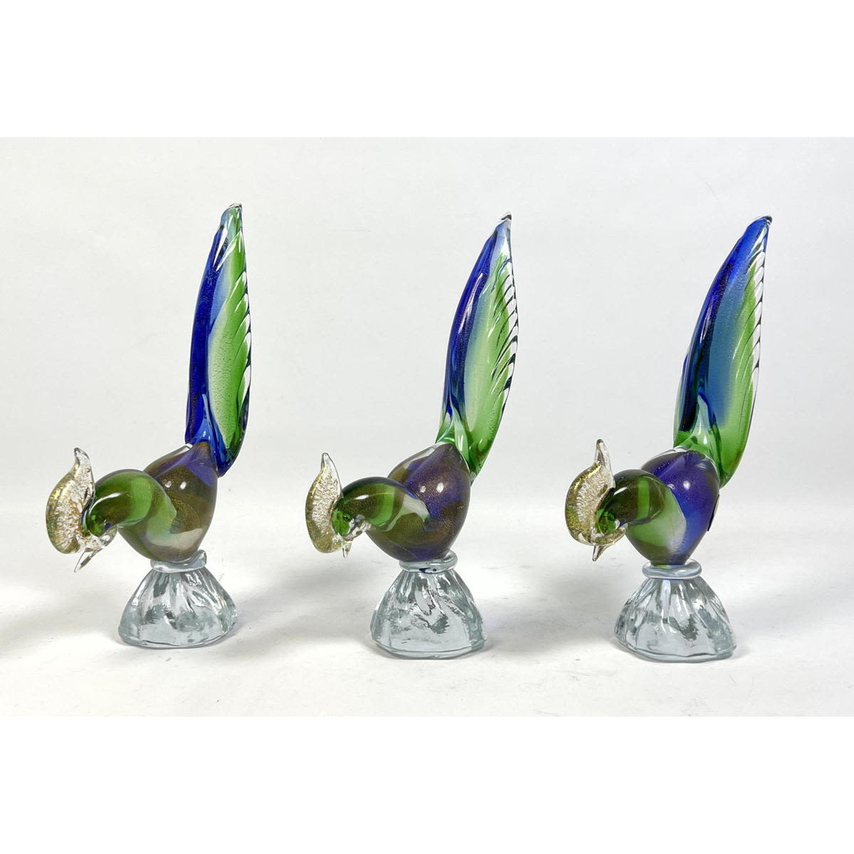 Appraisal: Set Murano Glass Bird Sculptures Colorful with gold flecks Dimensions