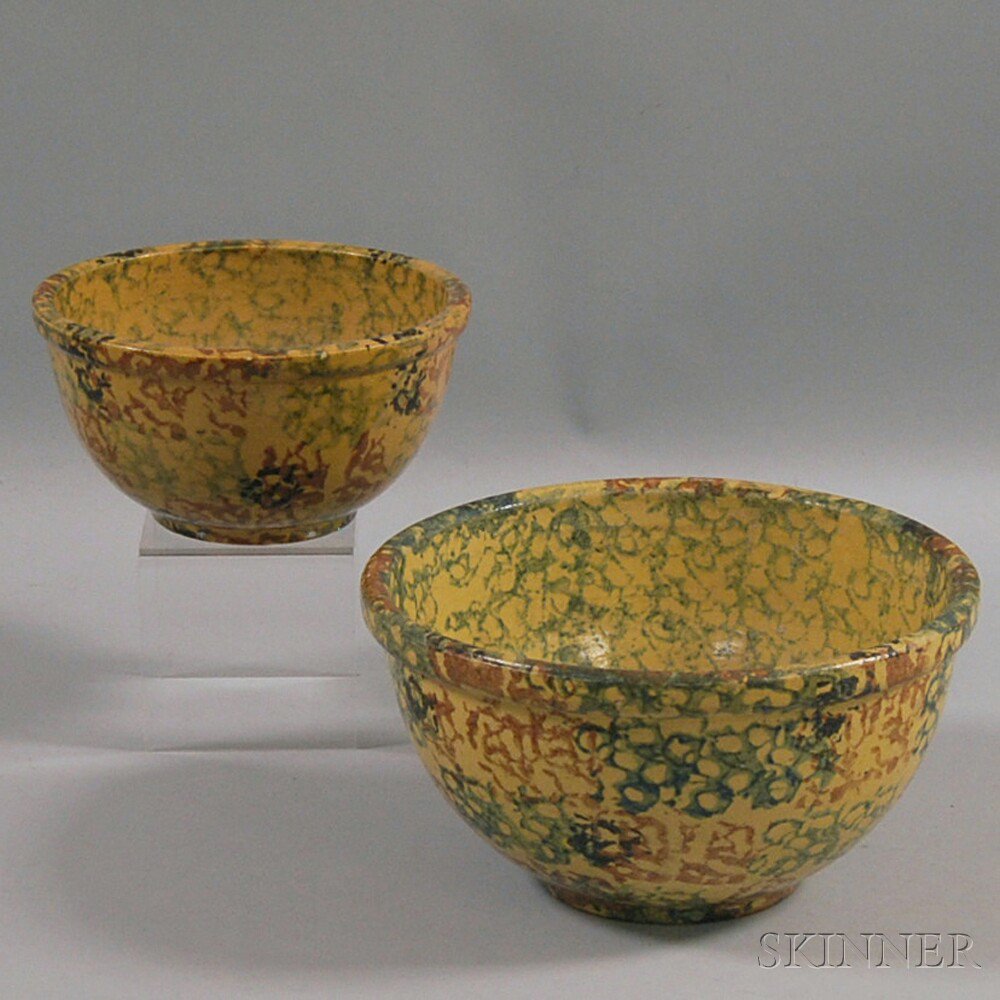 Appraisal: Two Sponge-decorated Stoneware Bowls deep round bowls with yellow glaze