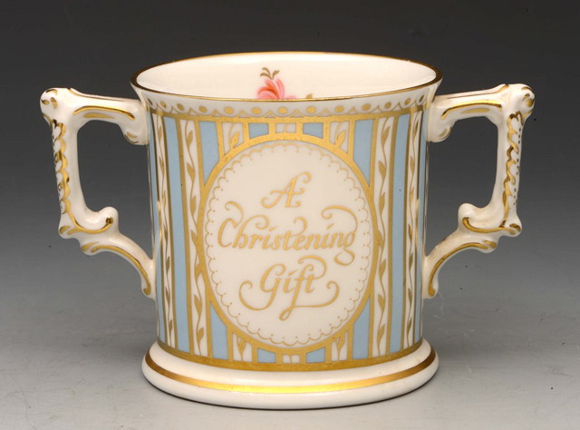 Appraisal: A ROYAL CROWN DERBY TWO HANDLED CHRISTENING TANKARD with oval