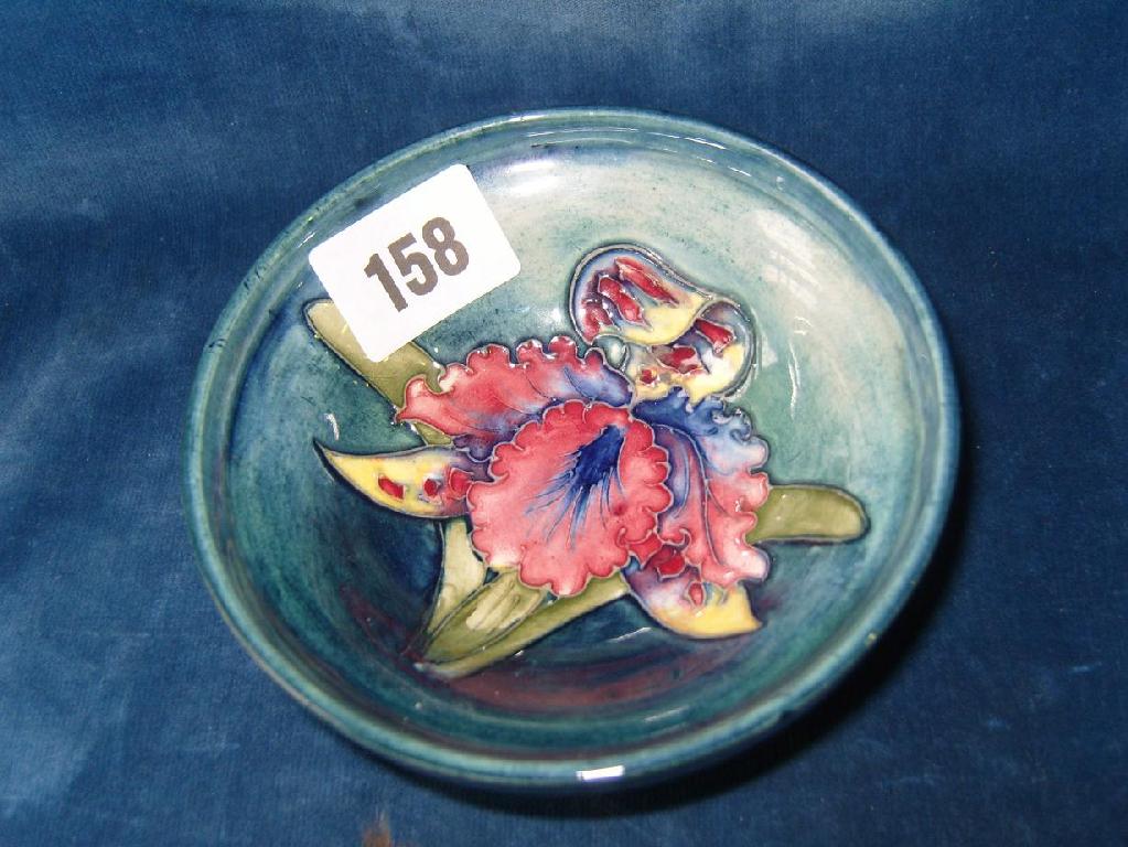 Appraisal: A Moorcroft bowl raised on a circular foot with painted