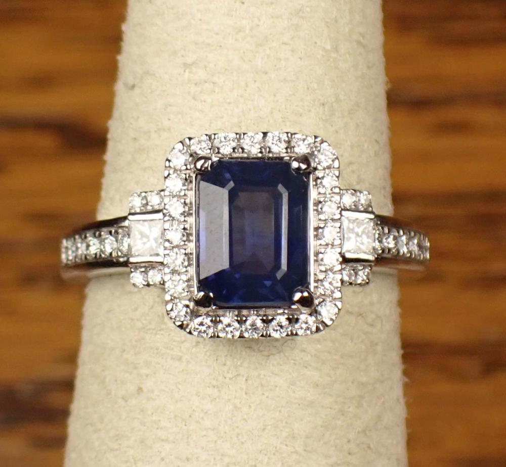 Appraisal: SAPPHIRE DIAMOND AND PLATINUM RING with round full-cut diamonds and