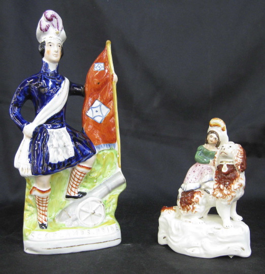 Appraisal: Two Staffordshire Pottery Figures one a rare figure of Scotland's