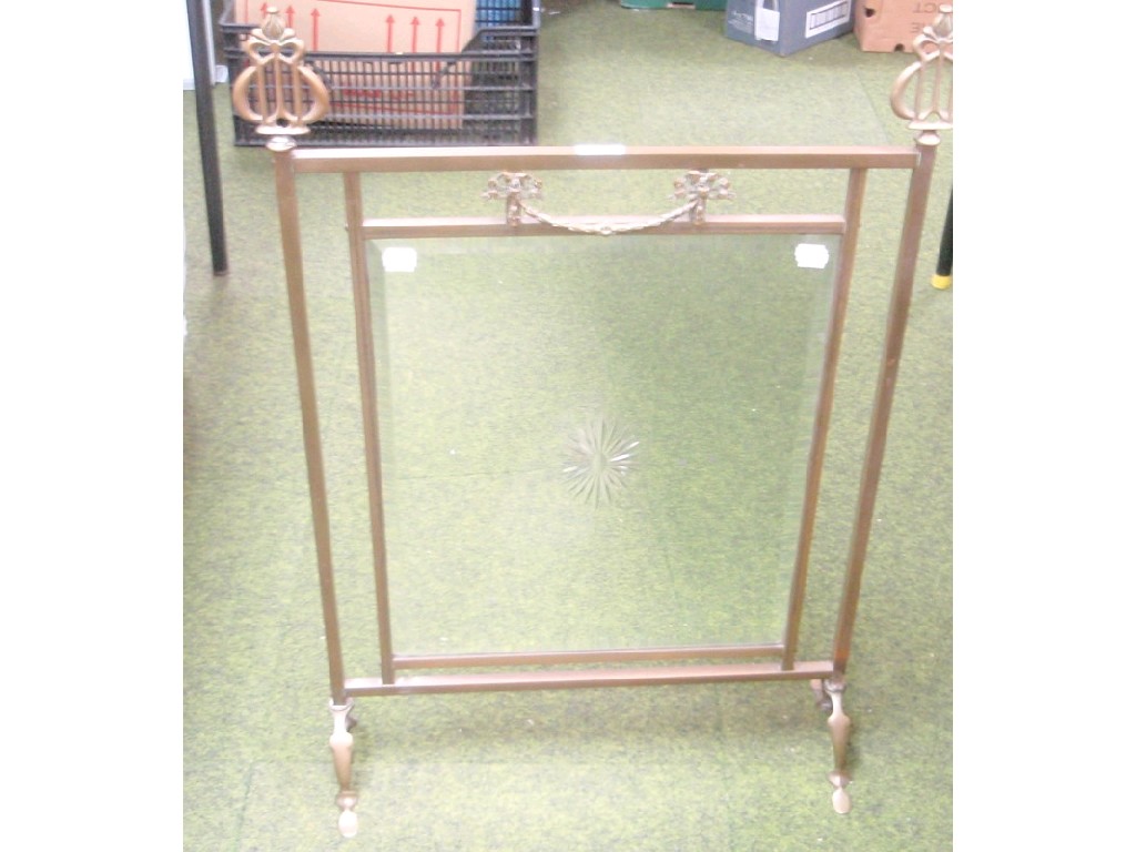 Appraisal: An Art Nouveau brass framed mirror fire screen