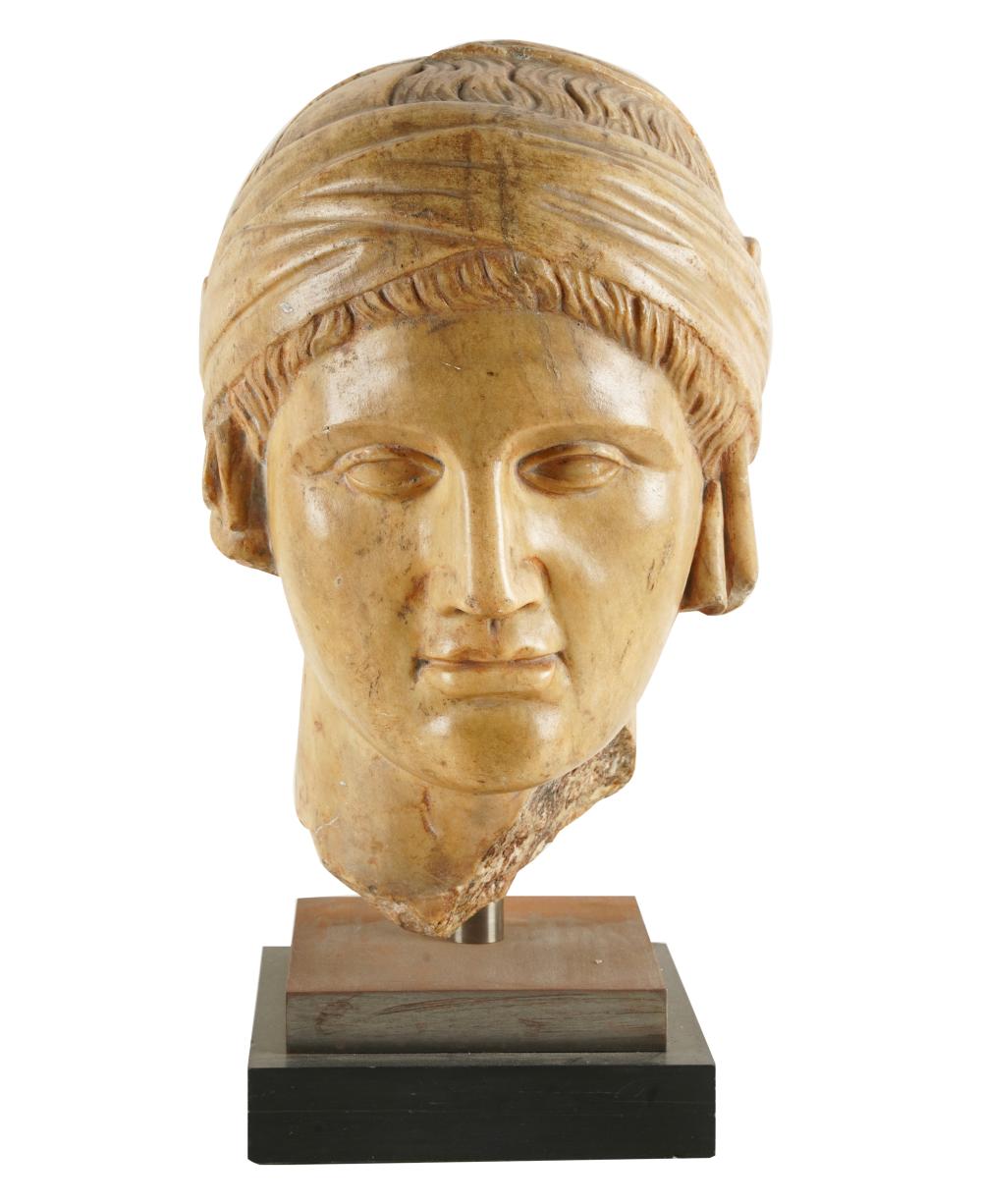 Appraisal: ANTIQUE-STYLE BUST OF A WOMANcast stone on a stepped base