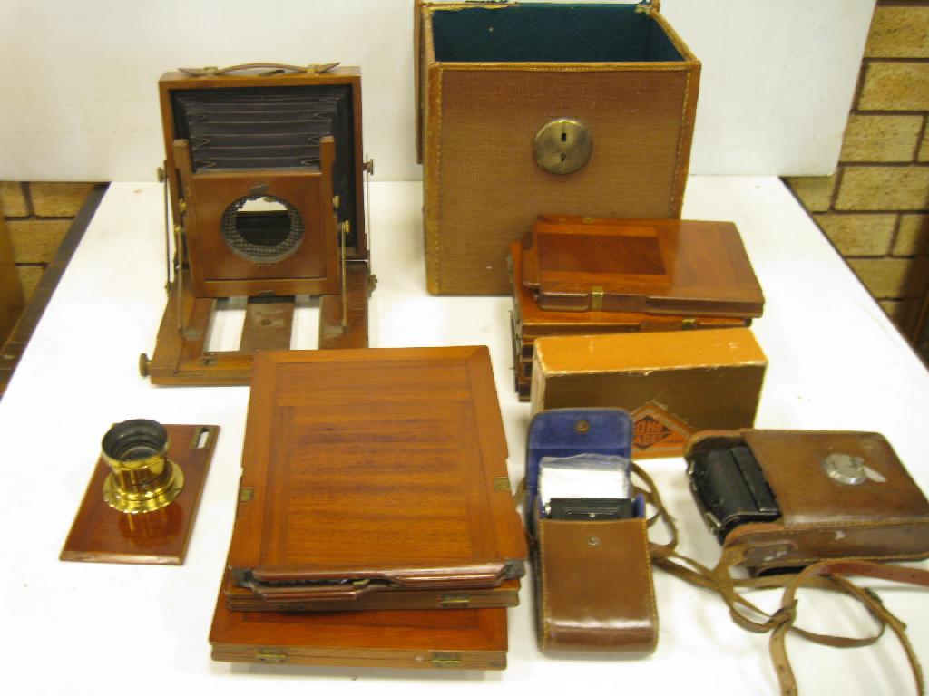 Appraisal: A mahogany Field Camera A F various Plate Holders Lens