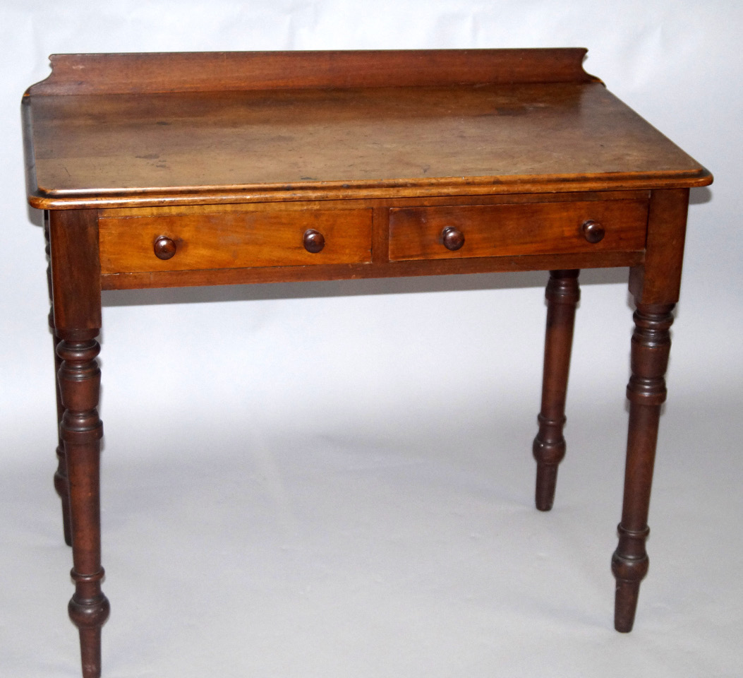 Appraisal: A Victorian mahogany hall table with a galleried back two