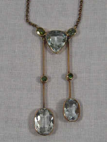 Appraisal: A carat gold aquamarine and peridot two drop pendant