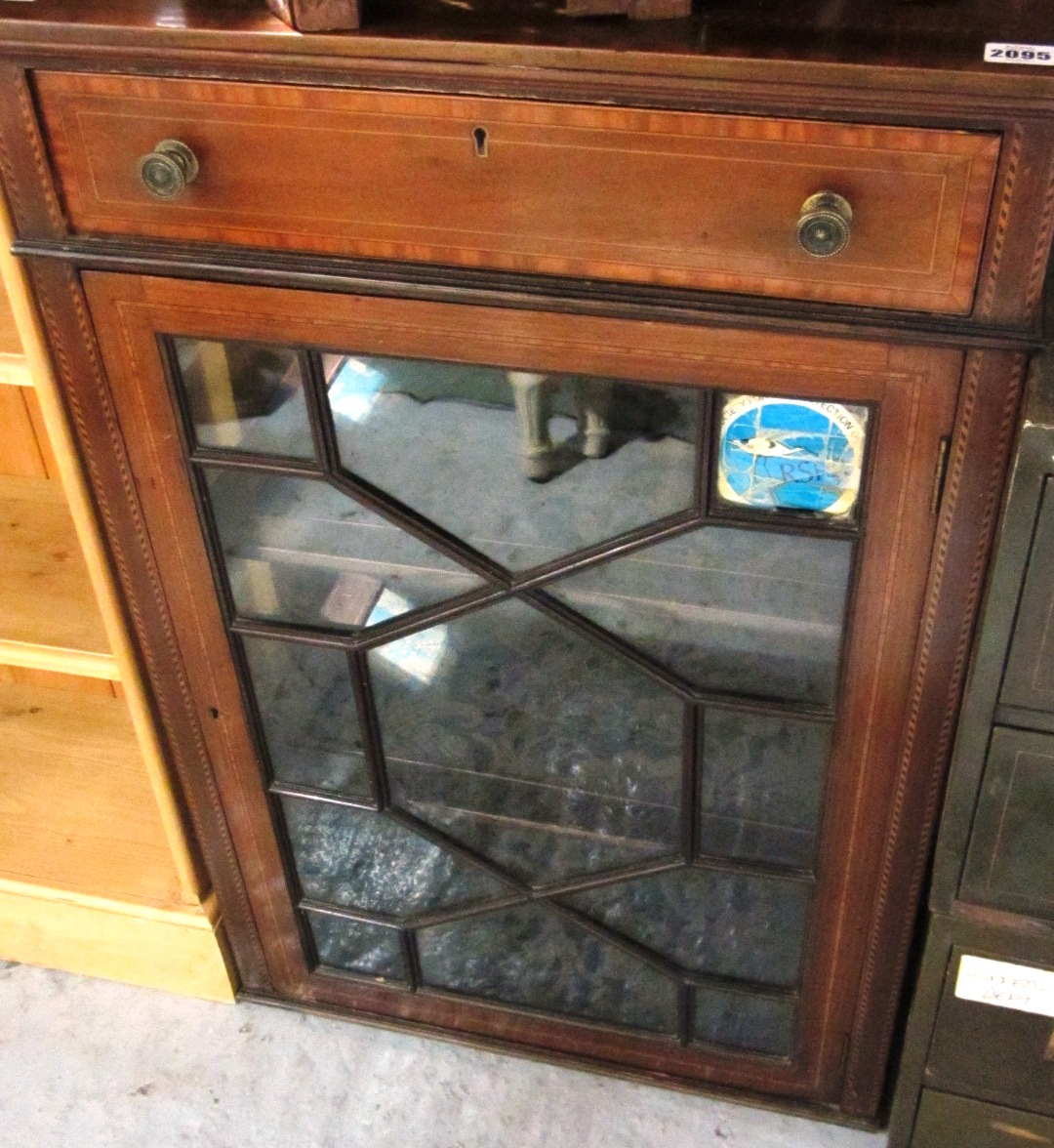 Appraisal: An Edwardian mahogany and chequer strung bookcase with an astragal