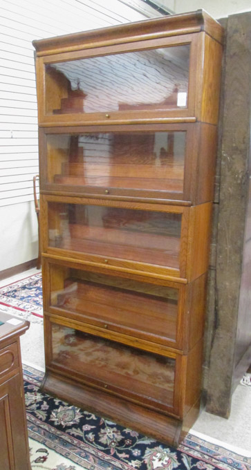 Appraisal: A STACKING OAK BOOKCASE American c having five stacking horizontal