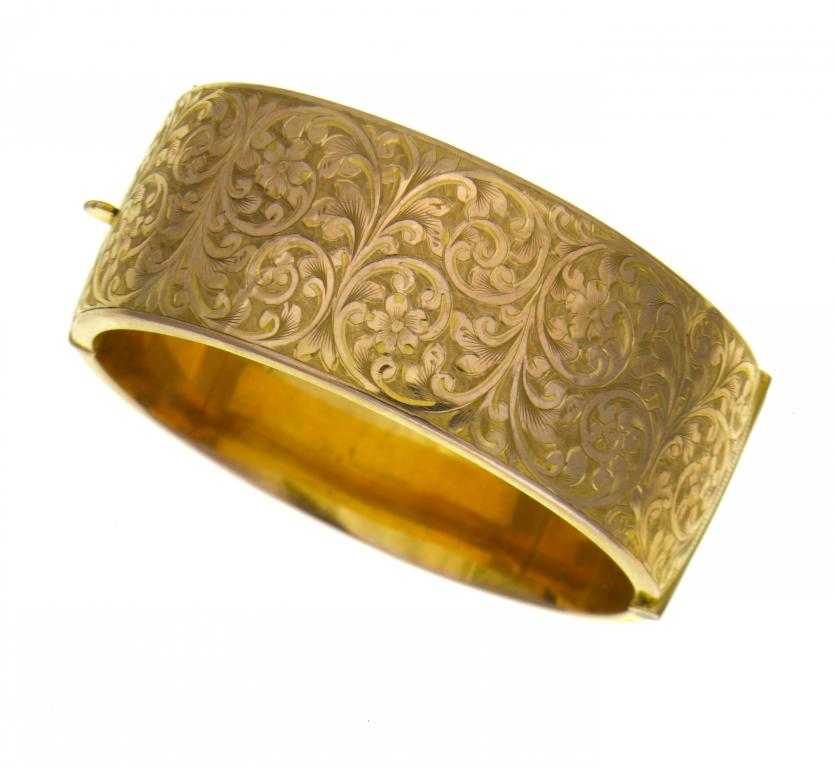 Appraisal: A CT GOLD BRACELET engraved with arabesques Birmingham