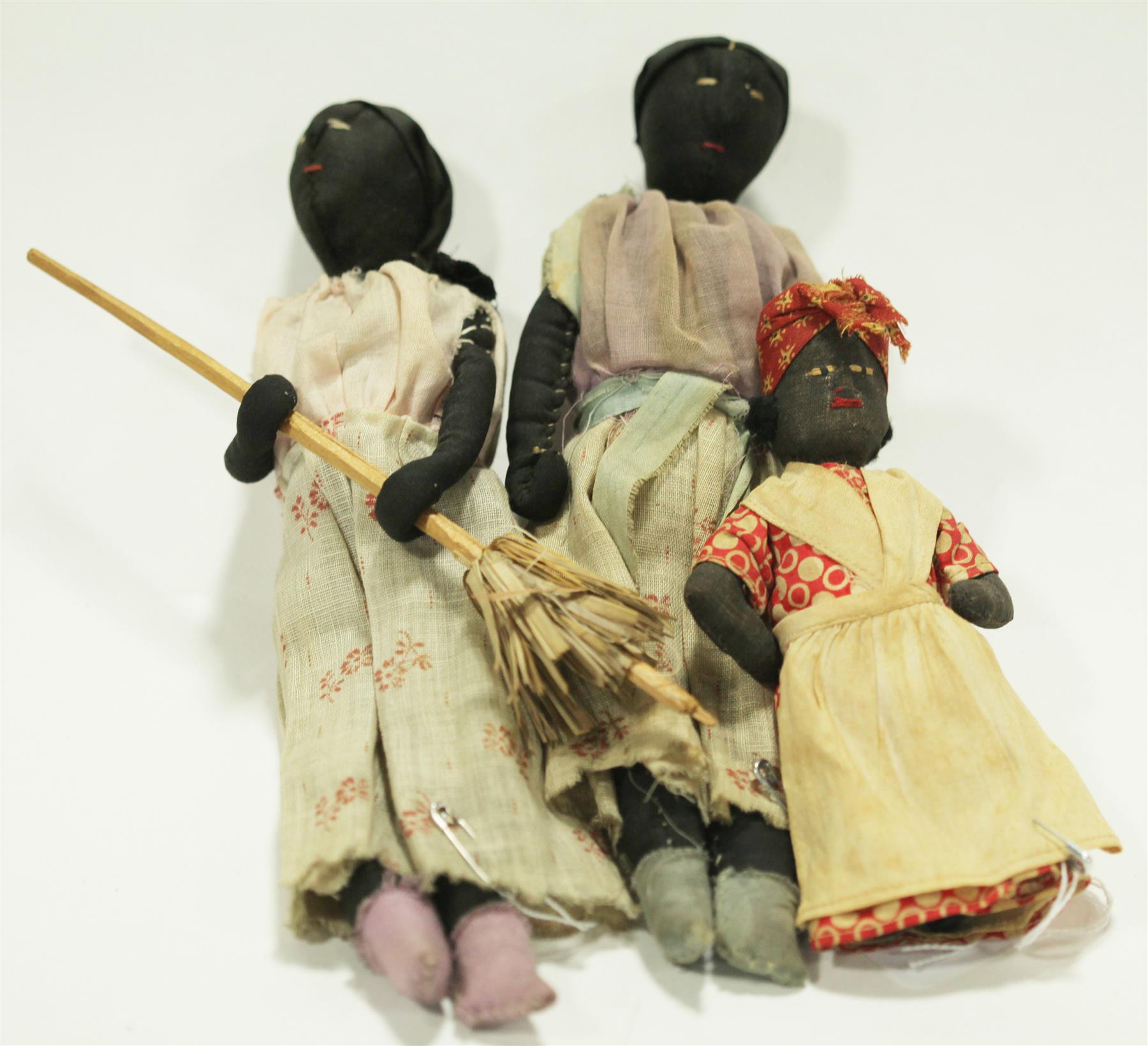 Appraisal: THREE SMALL BLACK CLOTH DOLLS Late th-early th century dolls