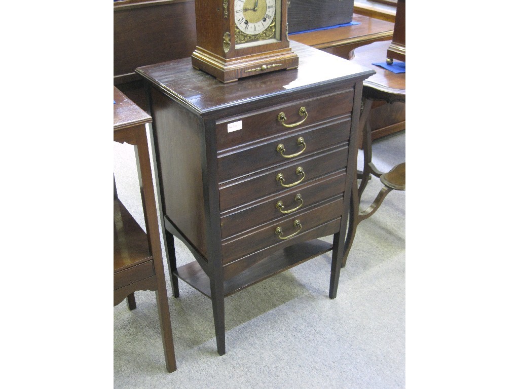 Appraisal: Mahogany five drawer music cabinet with a quantity of music