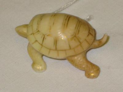 Appraisal: A ROYAL WORCESTER BLUSH PORCELAIN NETSUKE modelled as a tortoise