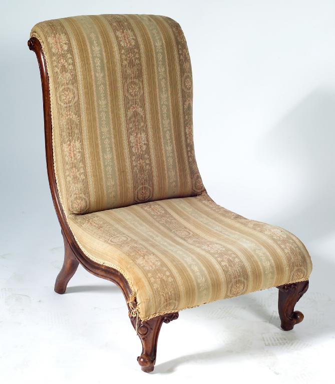 Appraisal: VICTORIAN MAHOGANY SLIPPER CHAIR c of elegant scrolling form raised