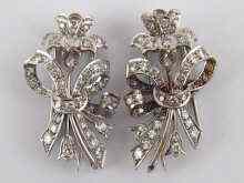 Appraisal: A pair of white metal tests carat gold diamond clips