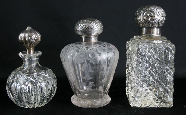 Appraisal: Three Victorian cut glass scent bottles with silver stoppers