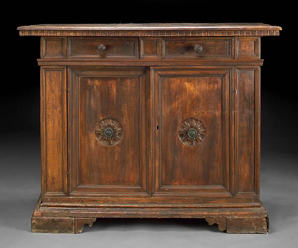 Appraisal: A Spanish Baroque style walnut credenza incorporating antique and later