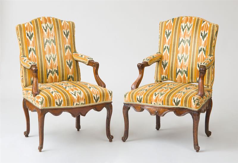 Appraisal: PAIR OF R GENCE PROVINCIAL WALNUT FAUTEUILS LA REINE Upholstered