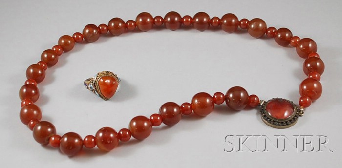 Appraisal: Two Carnelian Jewelry Items a beaded necklace and ring necklace