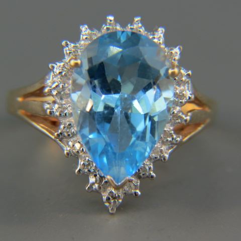 Appraisal: Blue Topaz Diamond Ring rich pear shaped carat gem surrounded