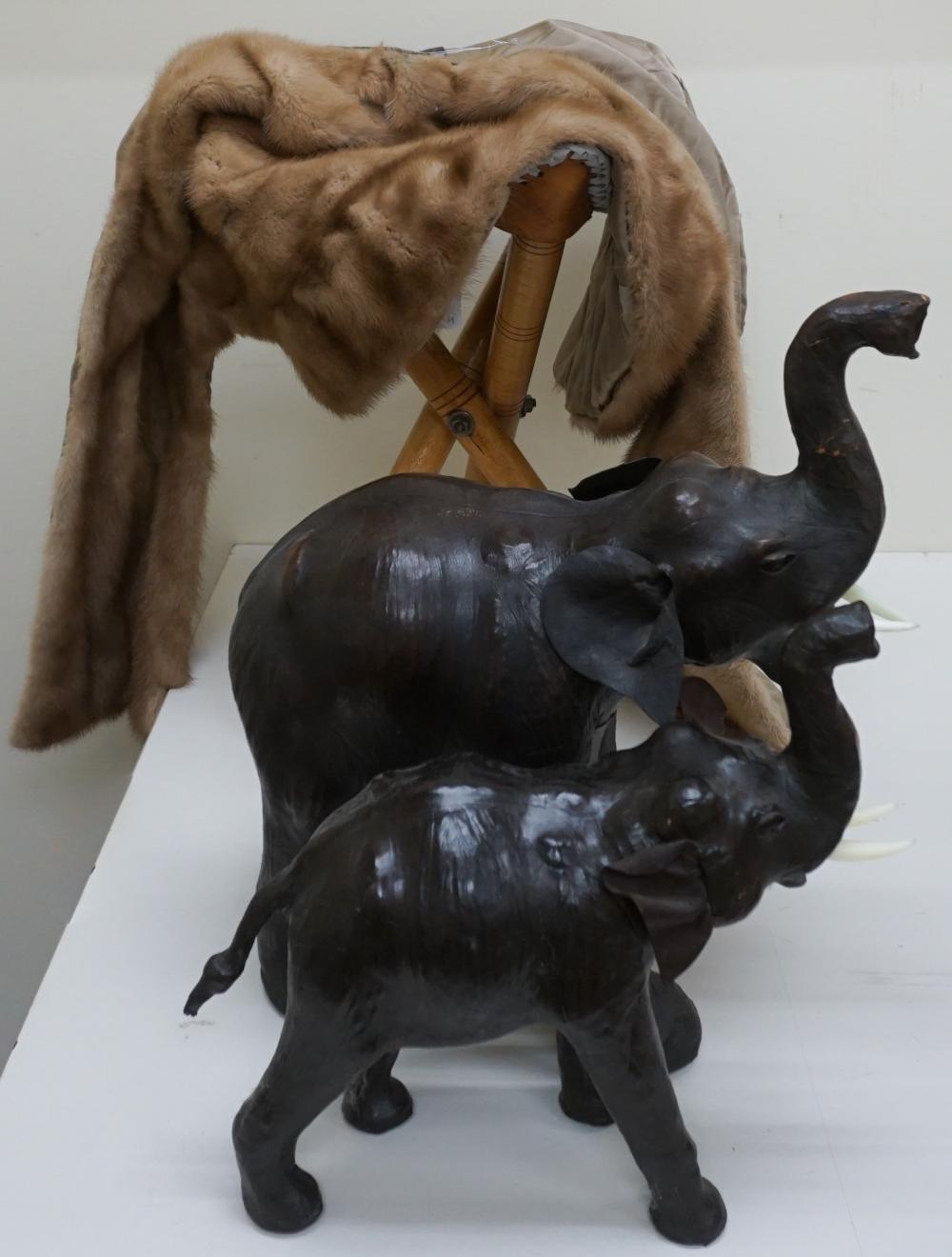 Appraisal: TWO LEATHER ELEPHANT FIGURES WITH AN ASSOCIATED STOOL AND A