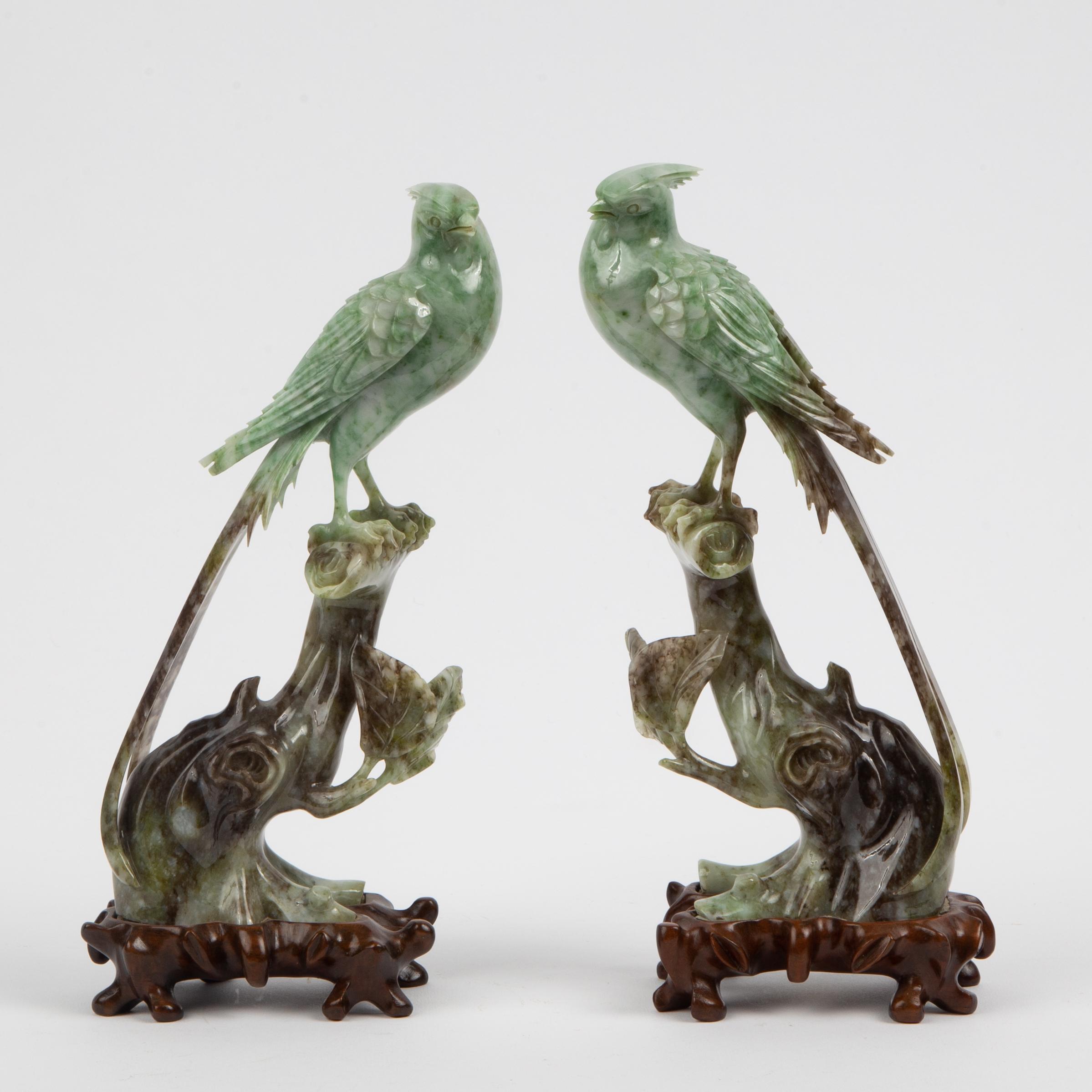 Appraisal: PAIR OF CHINESE CARVED SAUSSURITE BIRDS TH C Green and