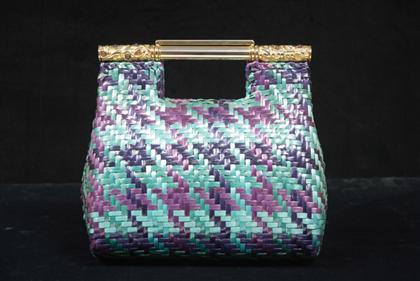 Appraisal: Woven raffia Rodo purse s- s Brightly dyed basketweave structured