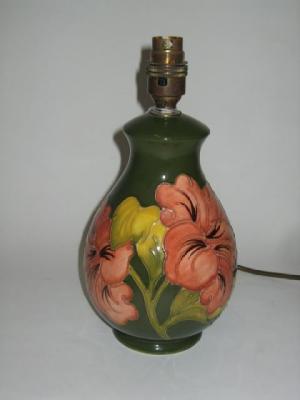 Appraisal: A MOORCROFT POTTERY LAMP of bellied form tube lined in