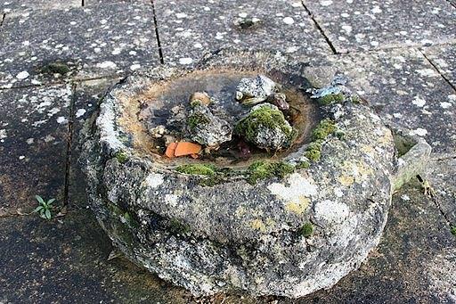 Appraisal: An irregular circular stone trough with a shallow top cm