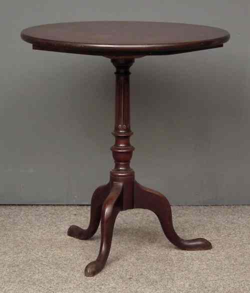 Appraisal: A George III mahogany circular tripod table on turned and