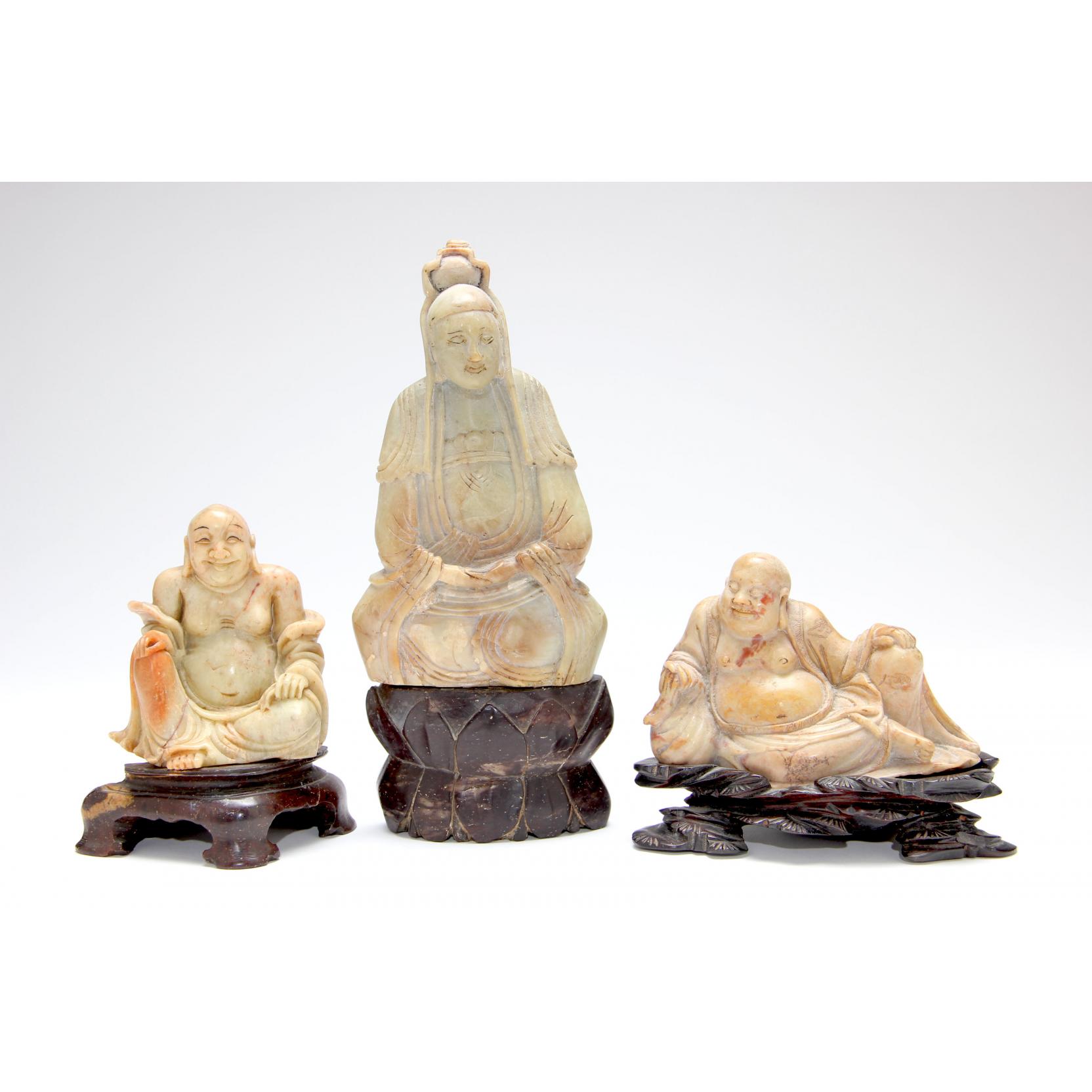 Appraisal: Three Antique Chinese Soapstone Carvings of the Buddha the first