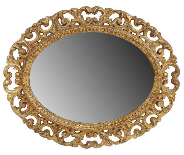 Appraisal: Italian Baroque style giltwood oval mirror late th c having