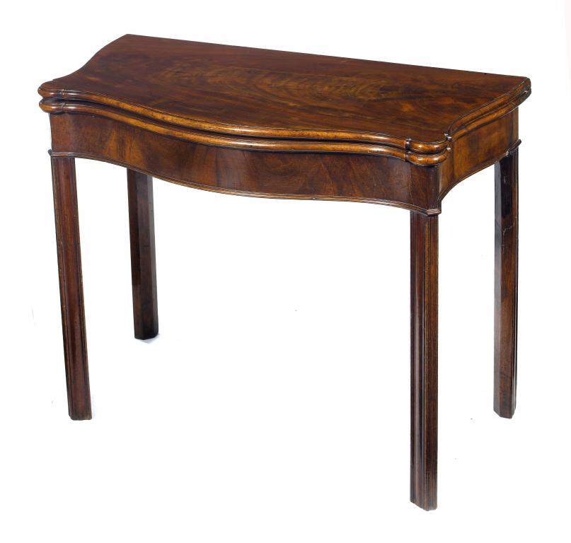 Appraisal: A GEORGE III MAHOGANY SERPENTINE TEA TABLE the figured top