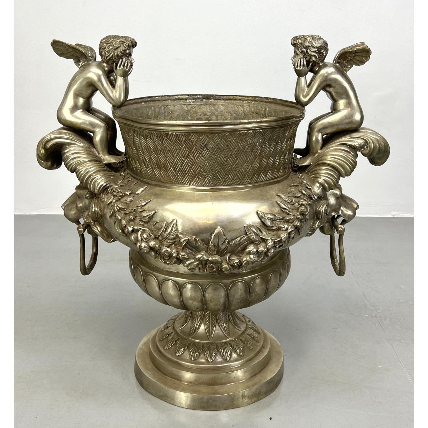 Appraisal: Large nickel coated French Style Urn Planter with cherub and