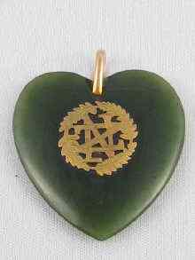 Appraisal: A nephrite jade New Zealand heart mounted in ct gold