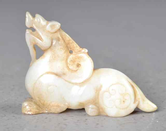 Appraisal: Chinese Carved Jade UnicornFinely carved and polished white to brown