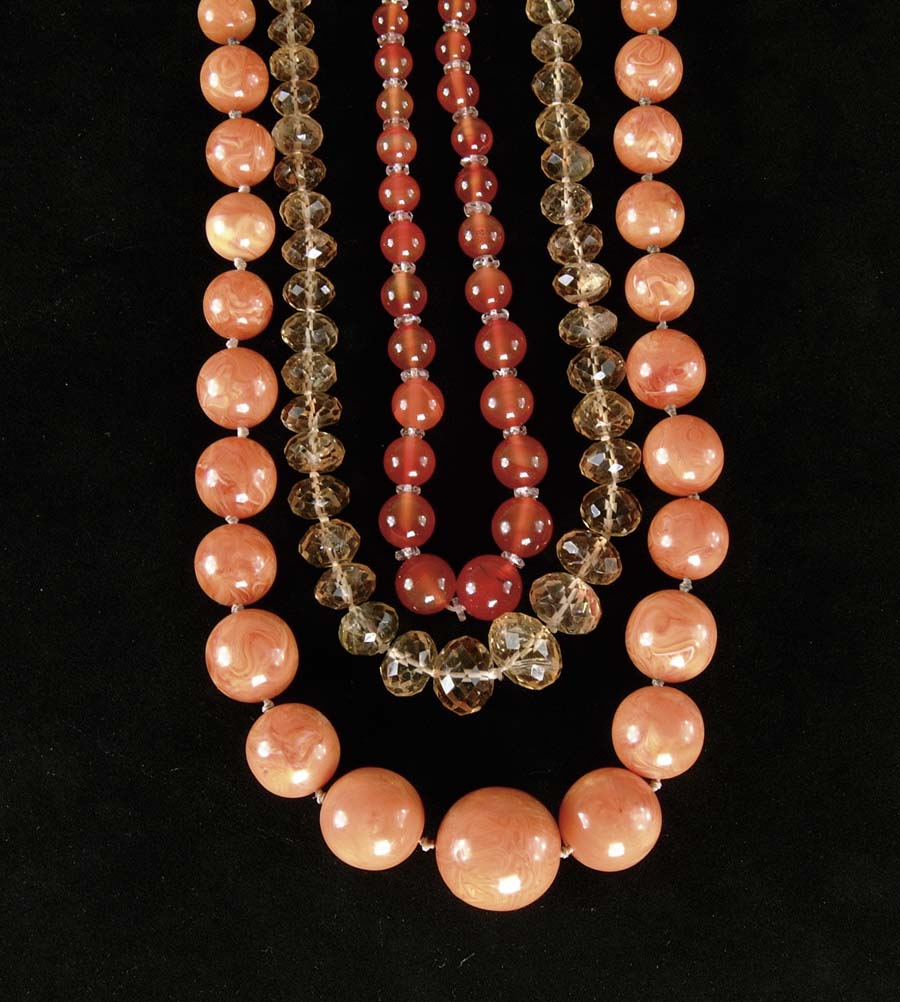 Appraisal: LOT OF THREE AMBER BEAD NECKLACES strand of graduated size