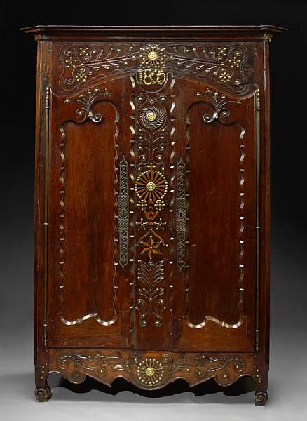 Appraisal: A Louis XV style carved oak brass inlaid armoire circa