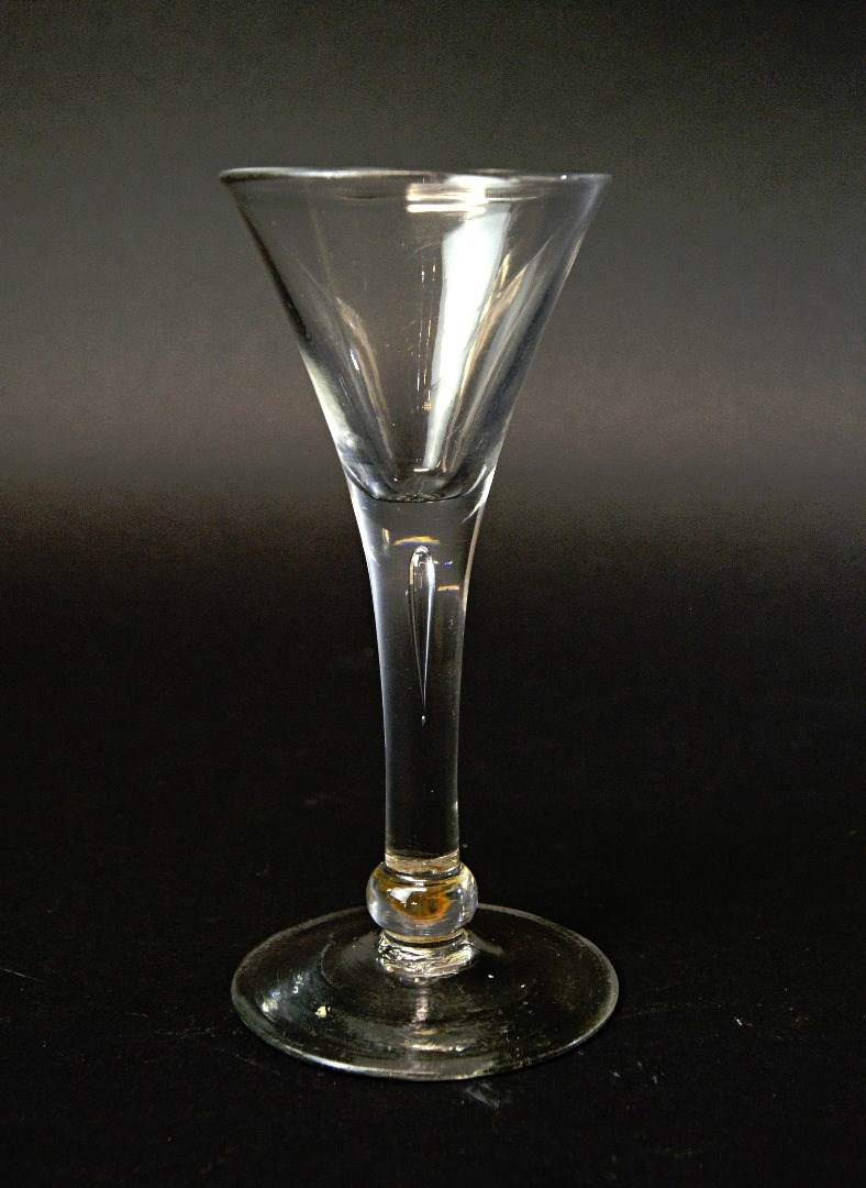 Appraisal: An English wine glass circa with a teared drawn trumpet