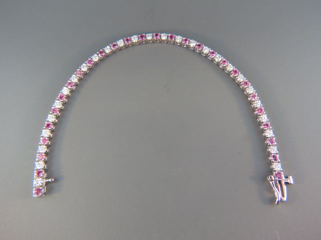 Appraisal: Diamond Pink Sapphire Bracelet round diamonds totaling carats and round