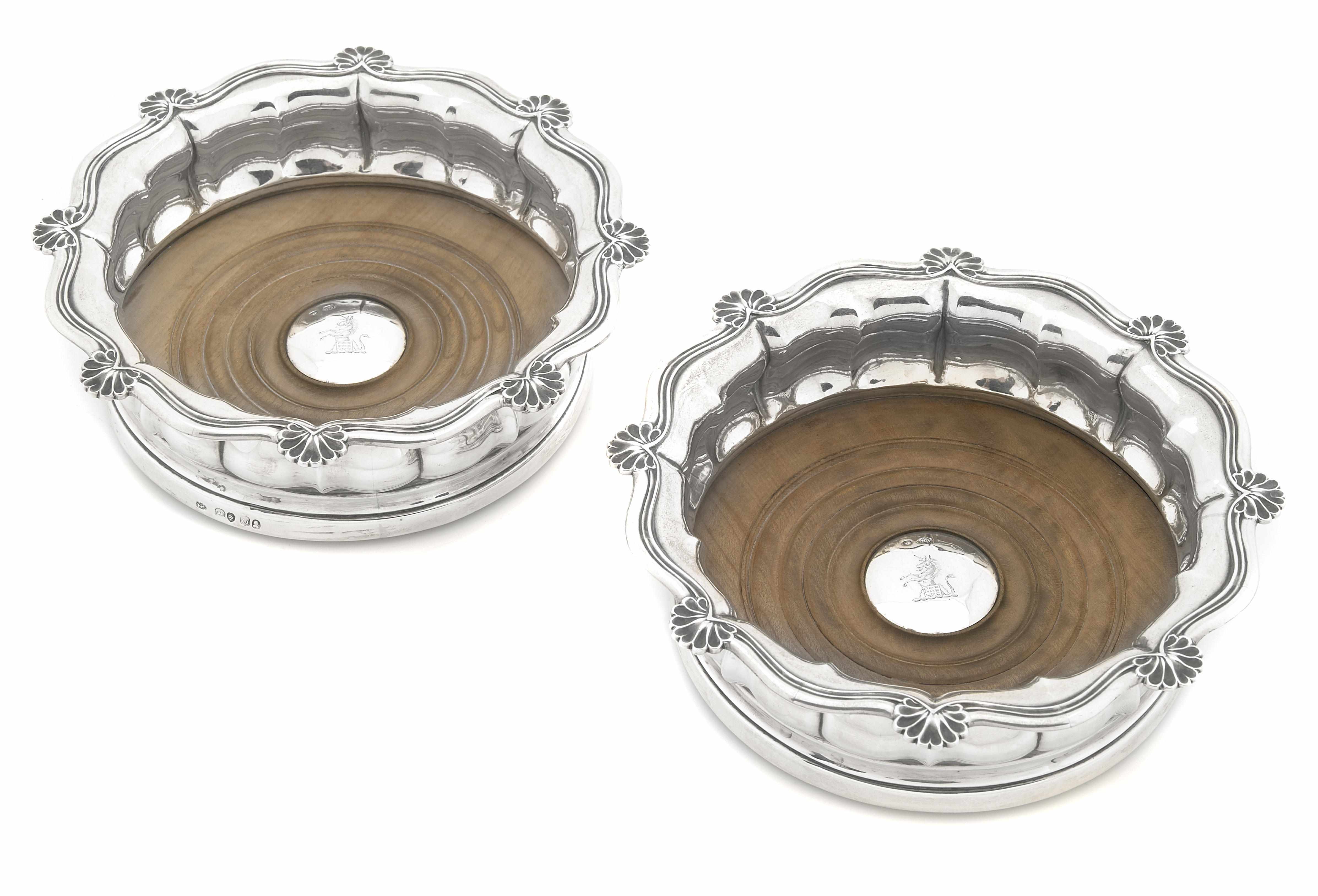 Appraisal: A pair of George IV sterling silver wine coasters Jonathan