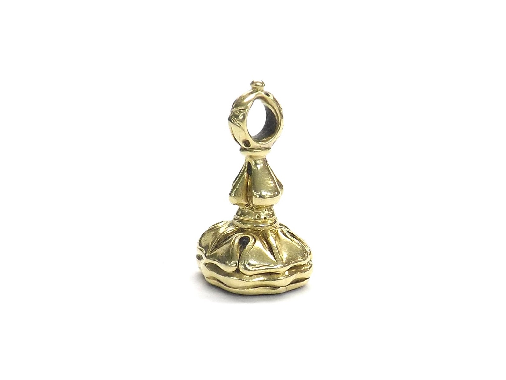 Appraisal: Miniature gold fob seal with a carved hardstone matrix gm