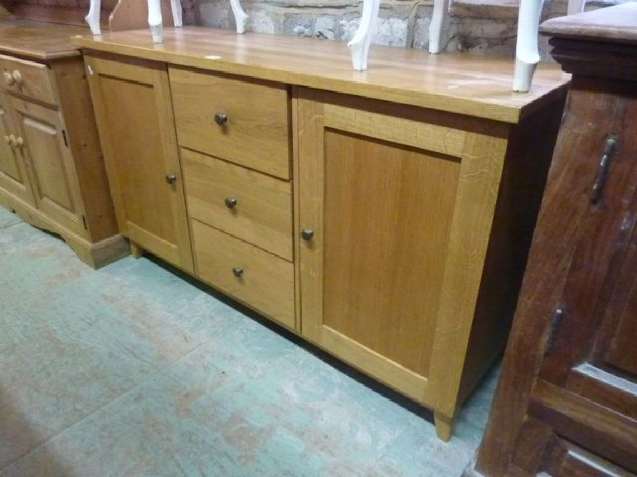 Appraisal: A good quality contemporary light oak sideboard fitted with three