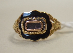 Appraisal: A gold and black enameled Victorian mourning ring glazed with