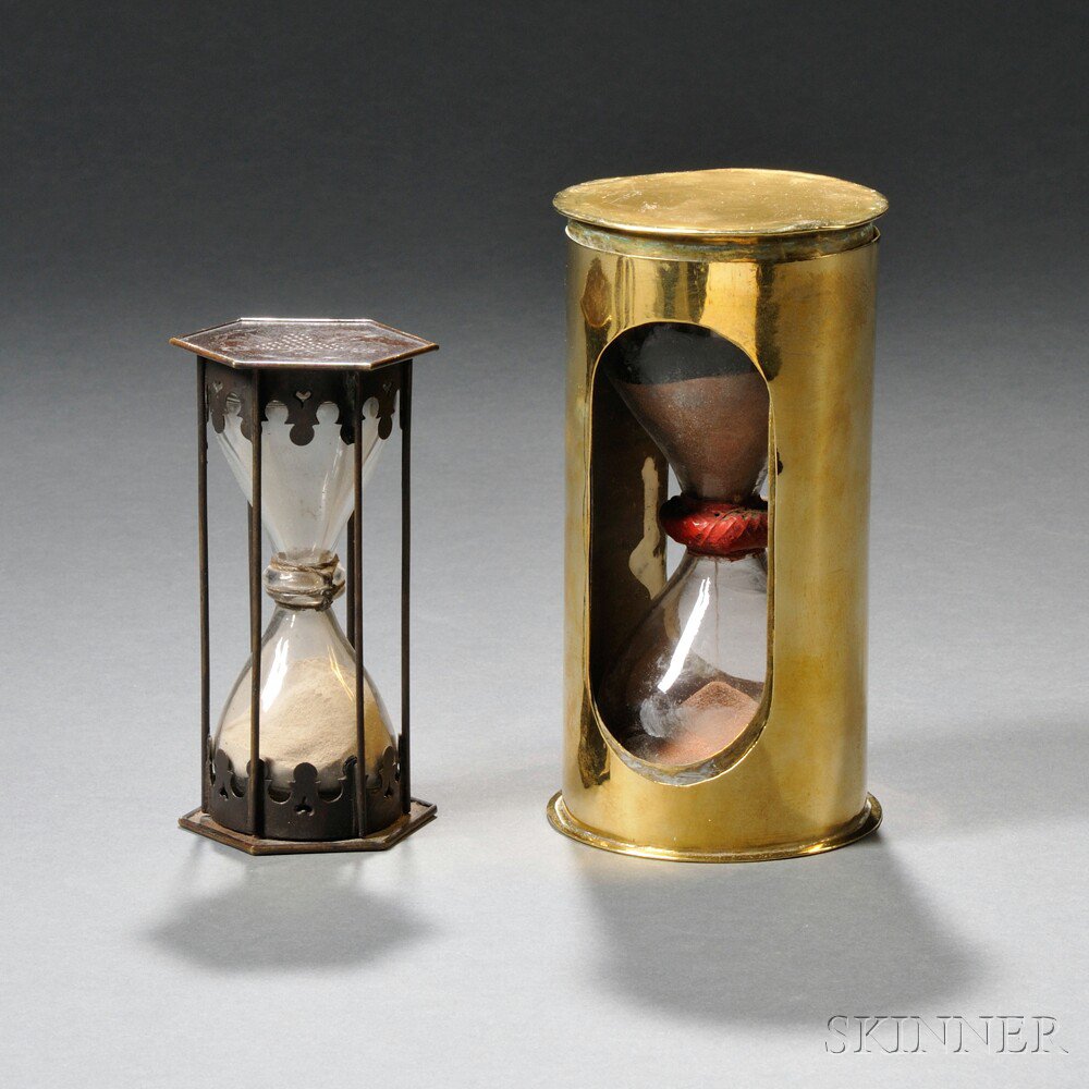 Appraisal: Two Early Bronze and Brass Hourglasses a bronze-framed hourglass probably