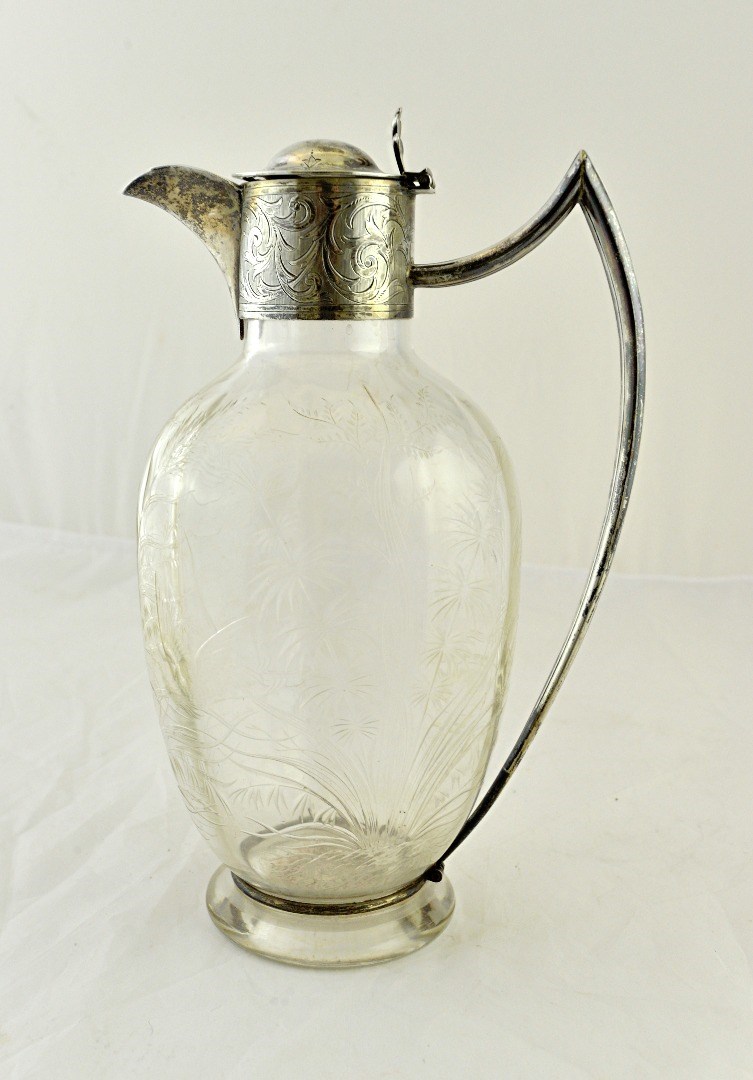 Appraisal: A Victorian silver mounted glass claret jug the body of