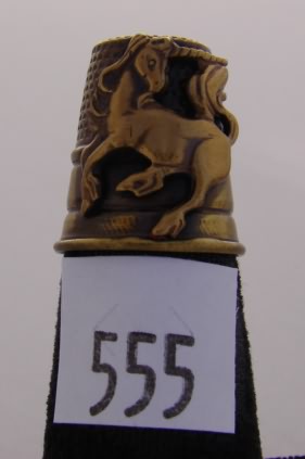 Appraisal: Gold tone thimble with unicorn