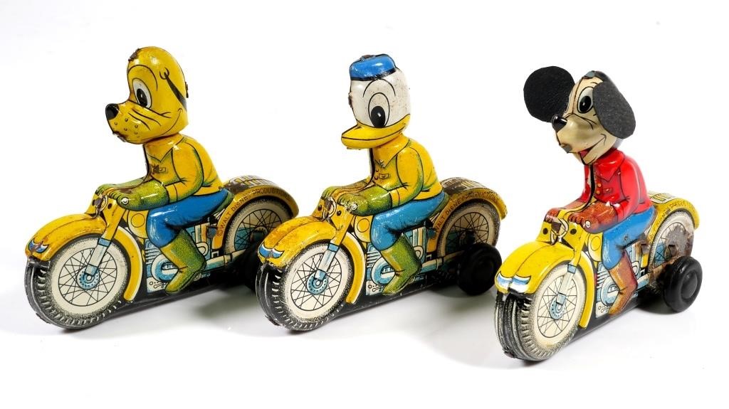 Appraisal: Three very scarce Walt Disney character tin friction toy motorcycles